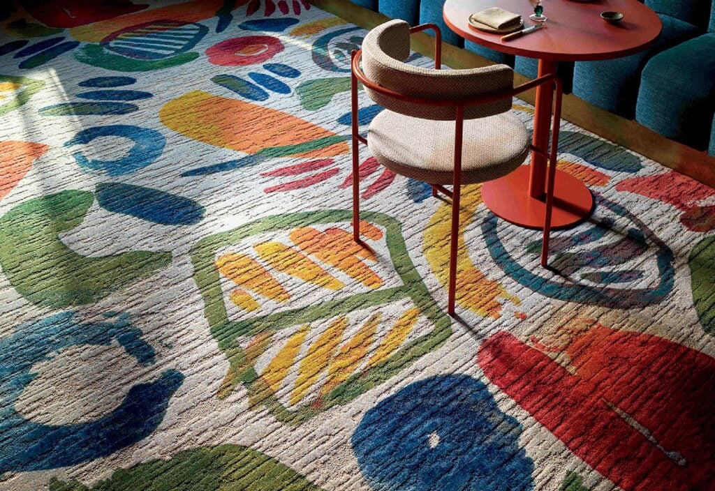 A colorful rug with a colorful floral design.