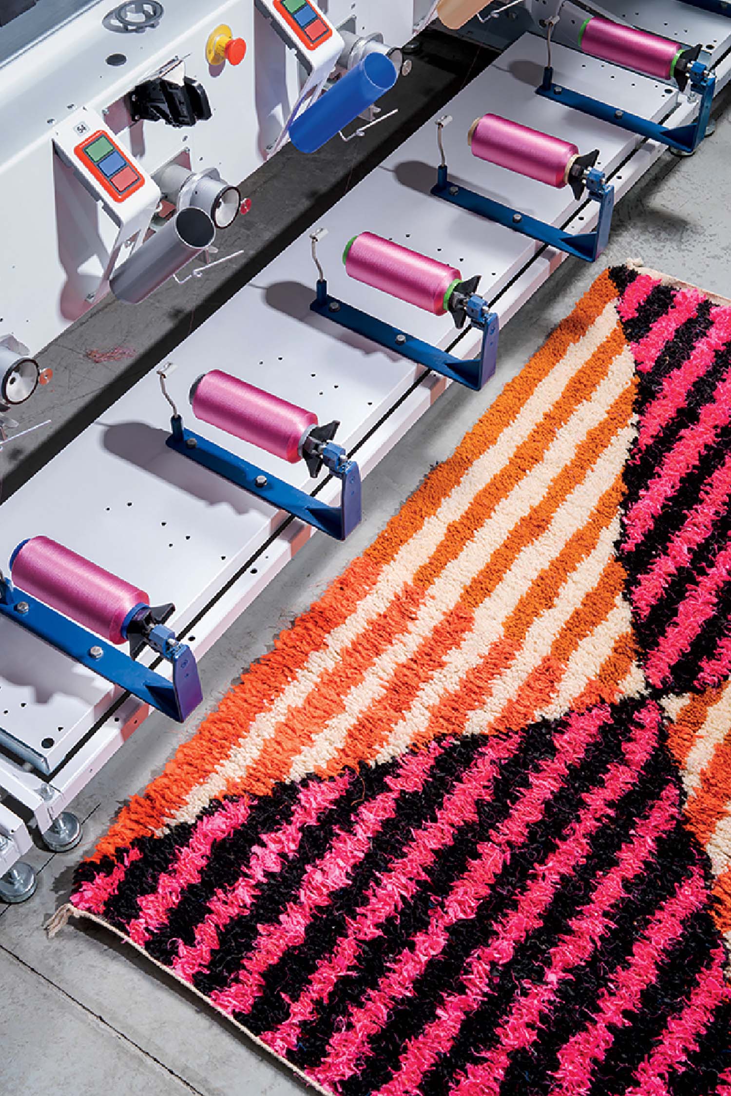 A machine that is cutting a rug.