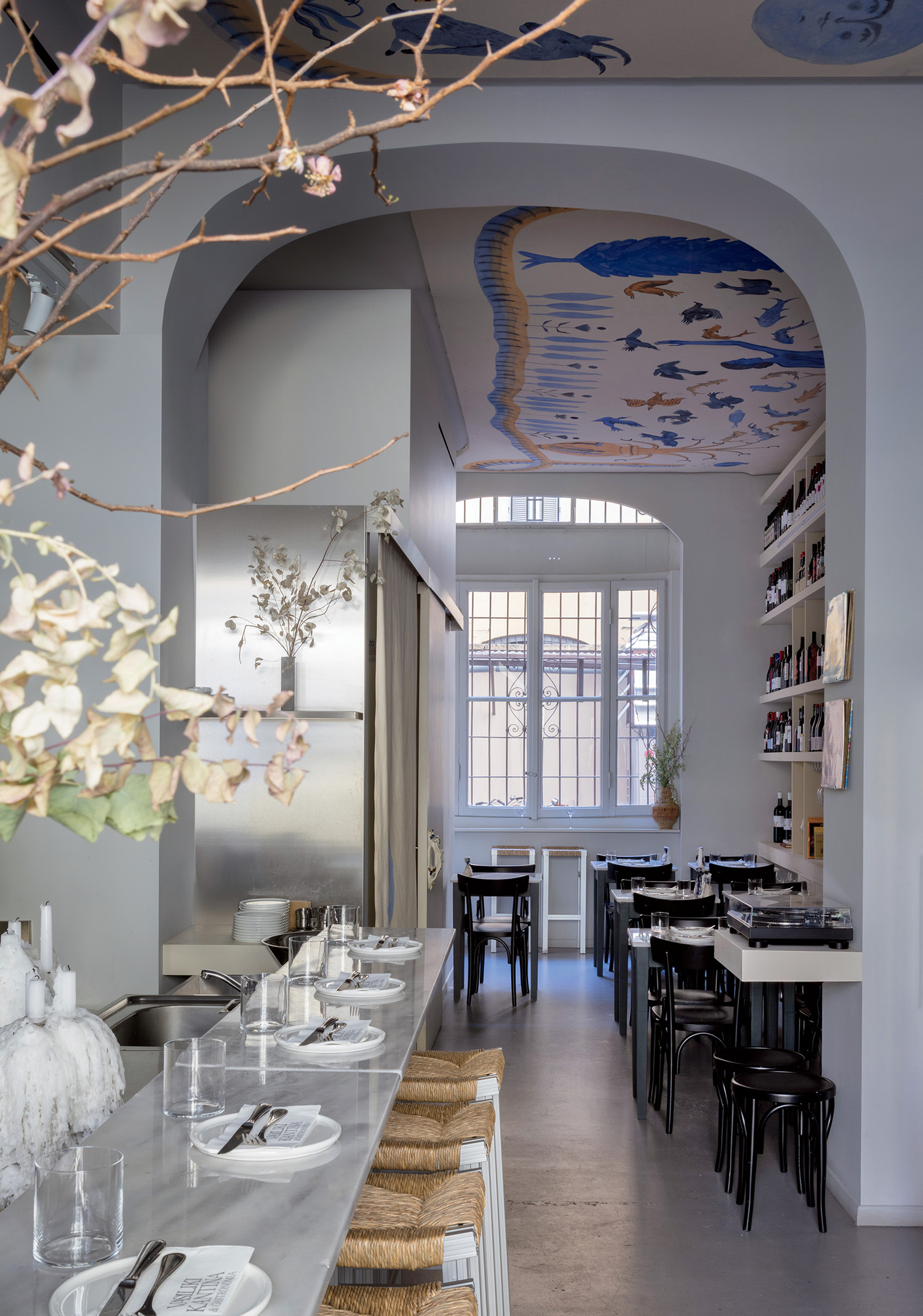 A long table with plates and utensils on it