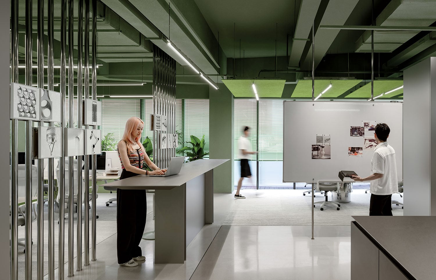 A man and woman are working in an office.