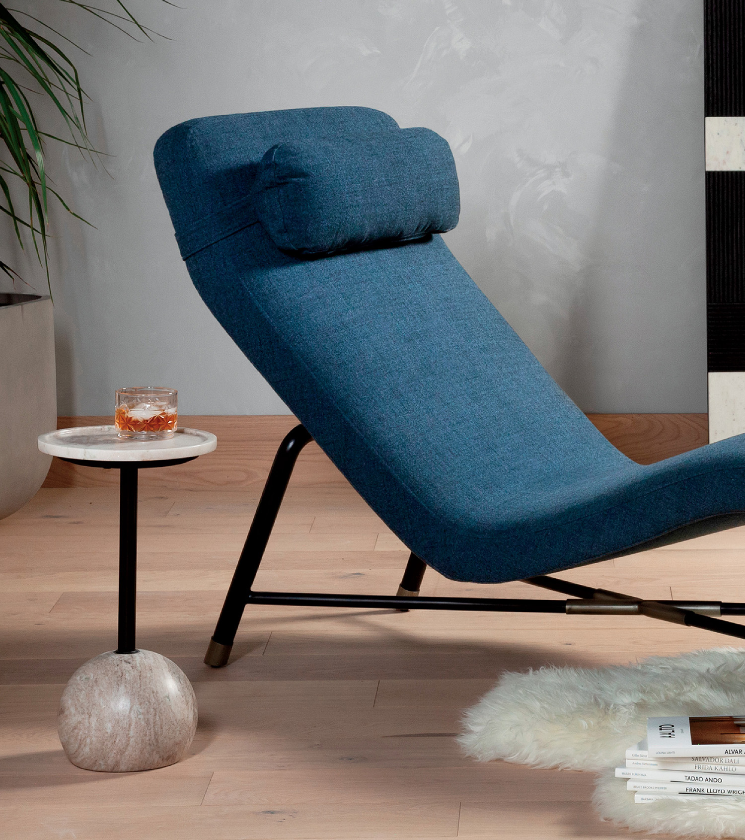 A blue chair sitting on a wooden floor