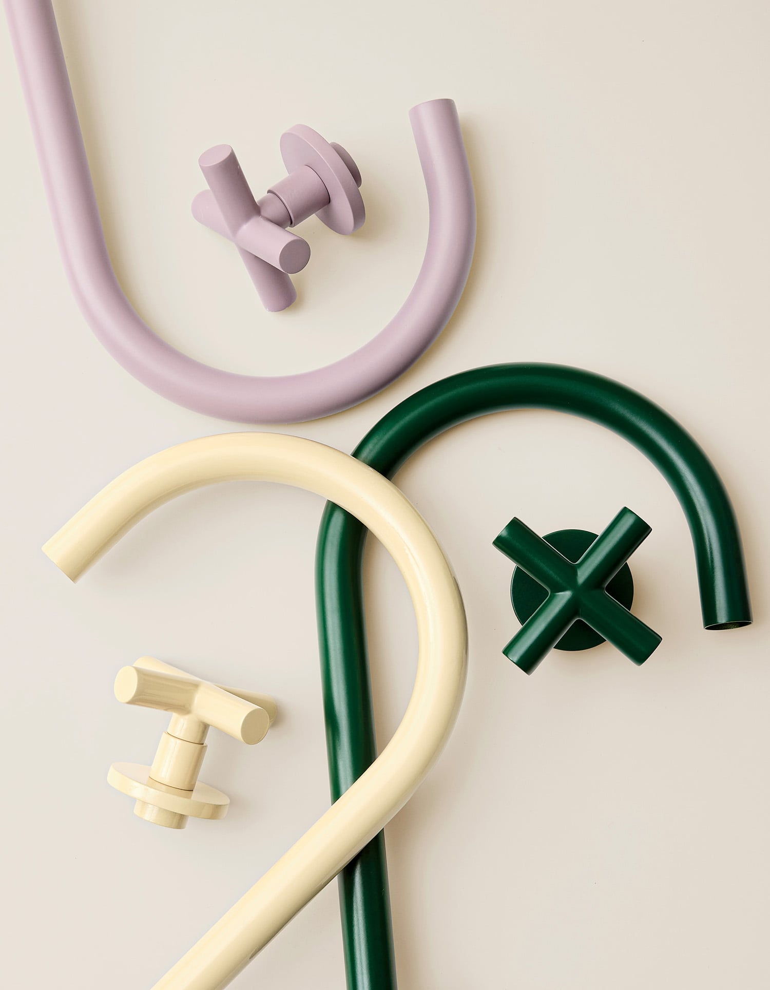 "A green and white pipe, a green pipe and a white pipe"