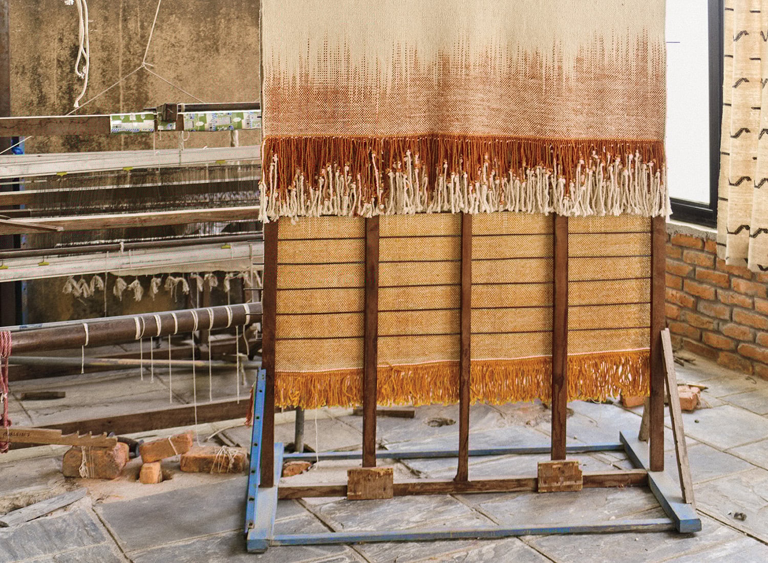 A piece of cloth is being made on a stand