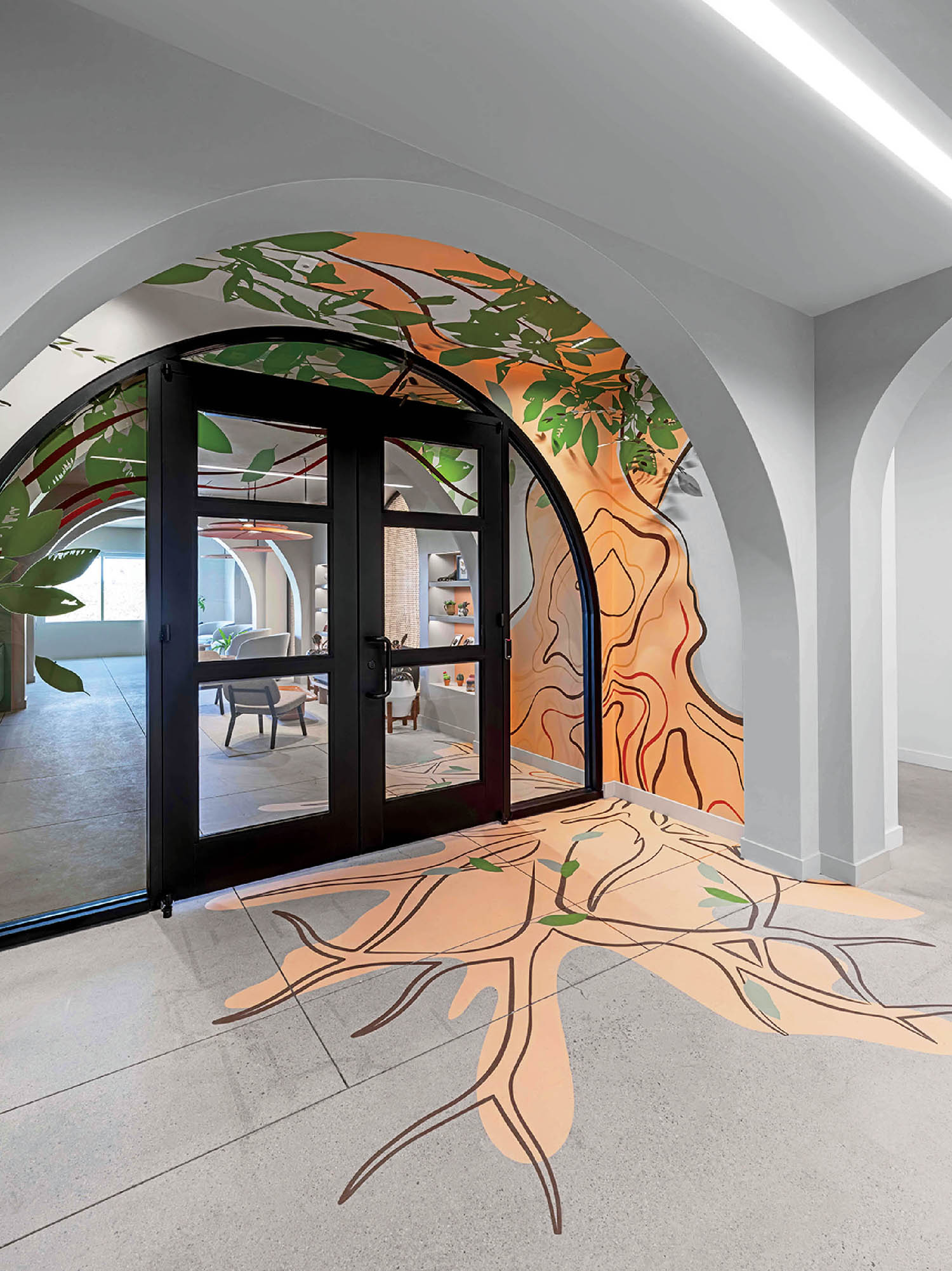 A mural of a tree in a building.