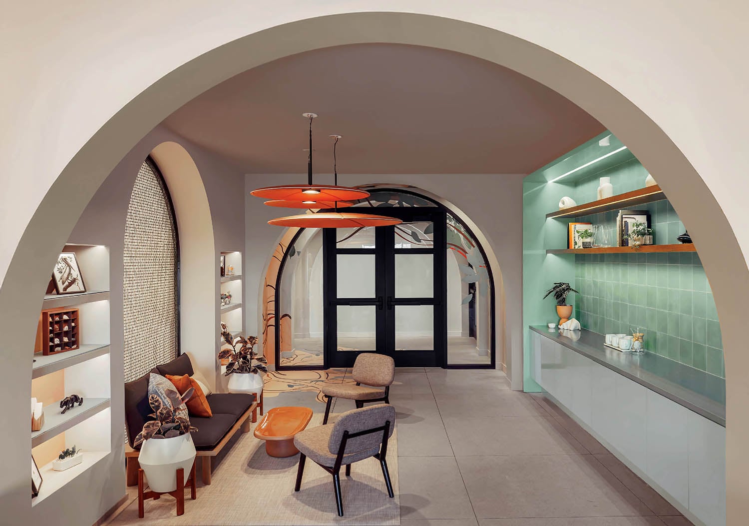 A living room with a large arched window.