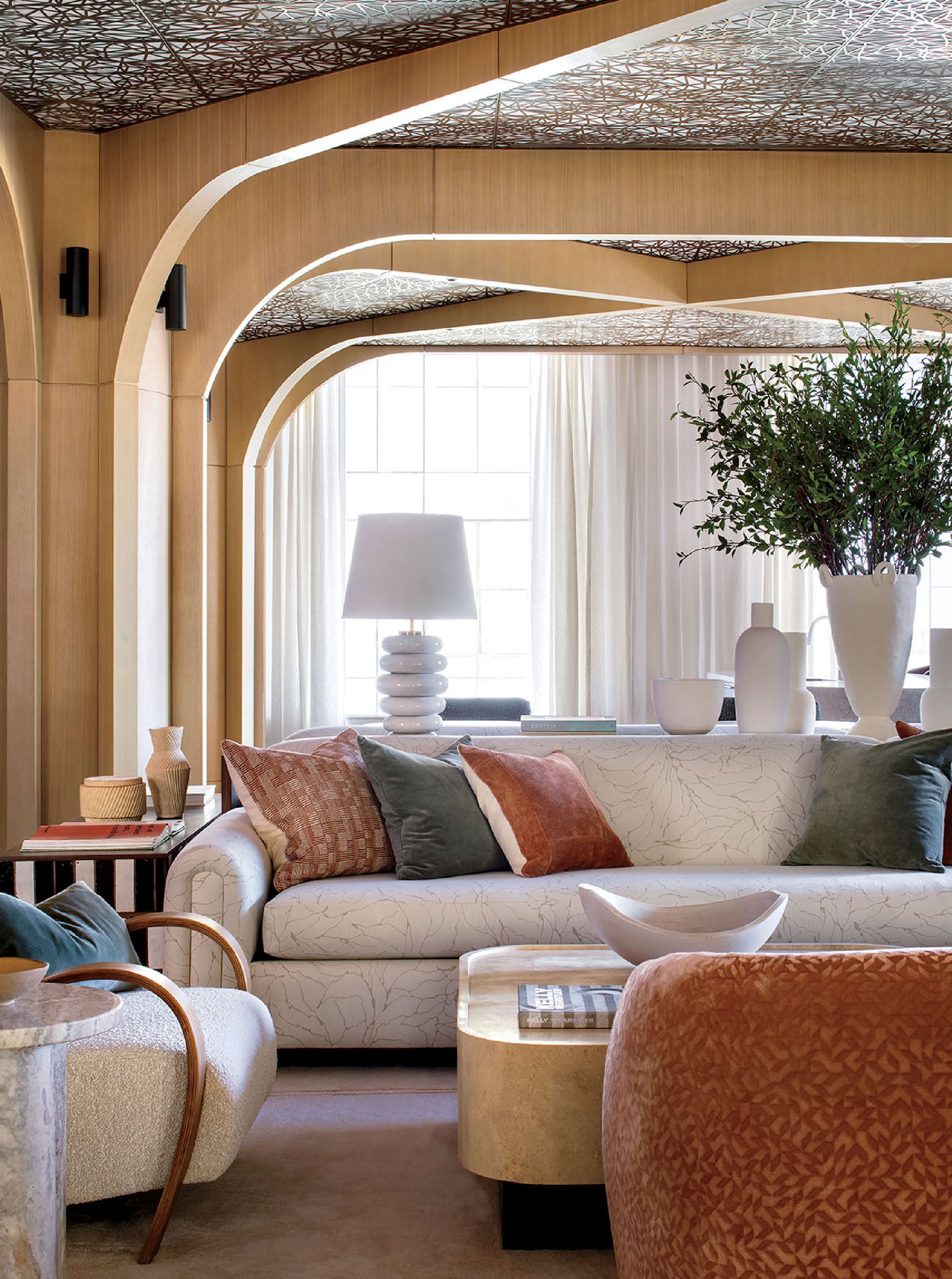 A living room with a couch and a chair.