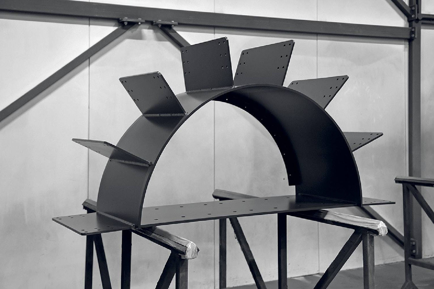 A black and white photo of a metal structure.