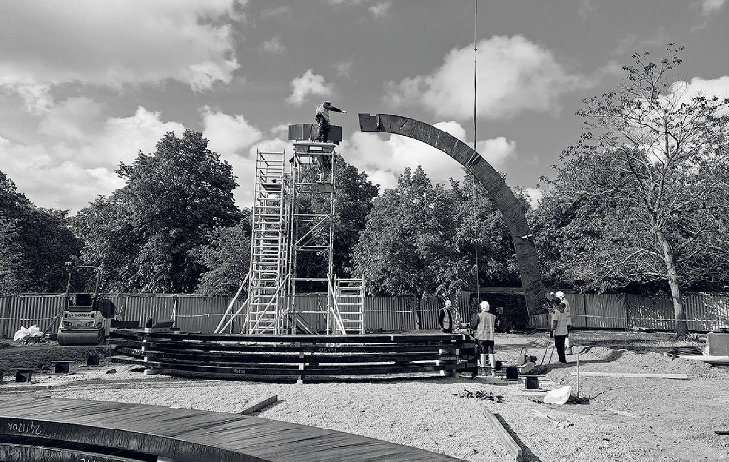 A black and white photo of a construction site.