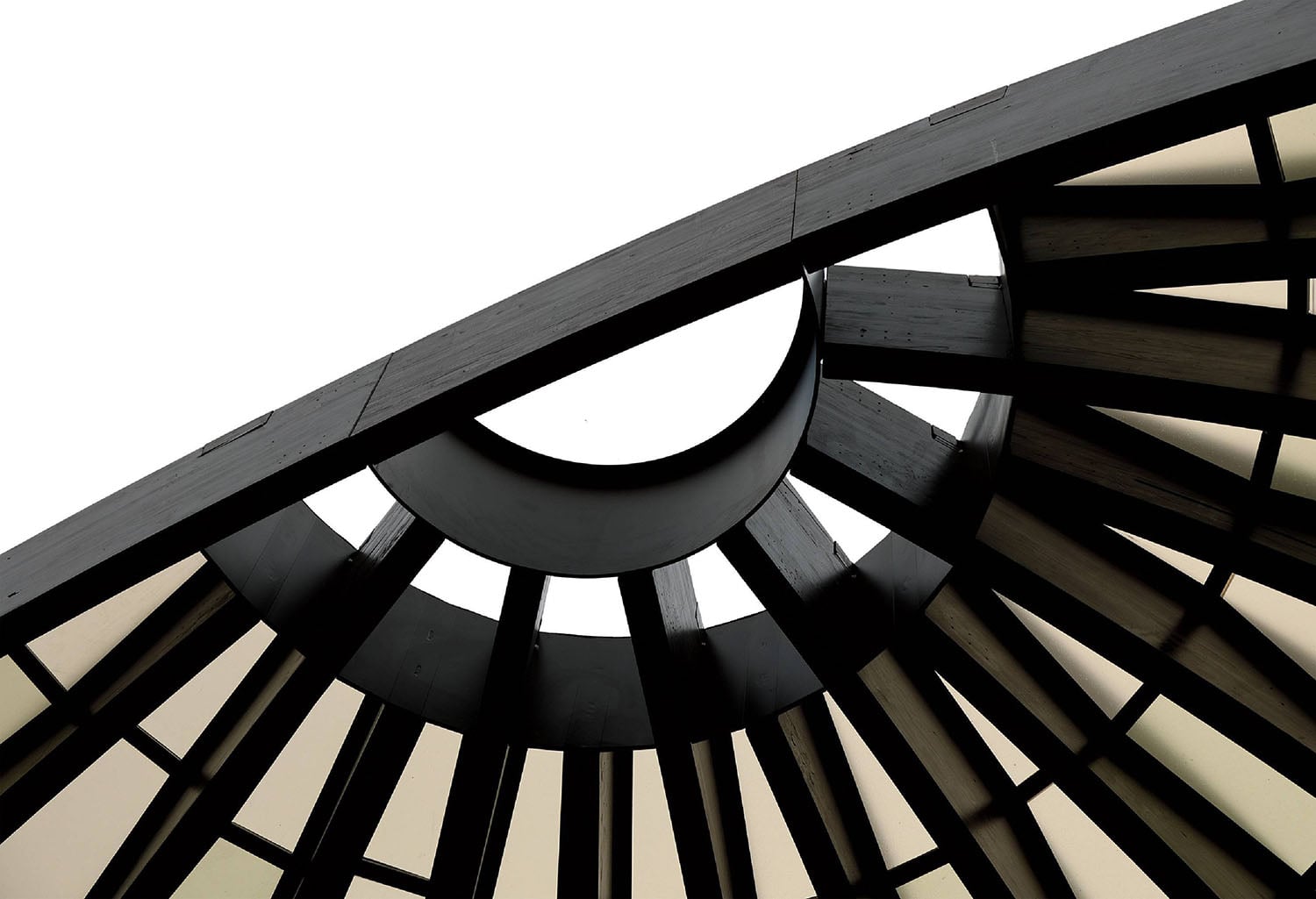 A clock with a white sky in the background.