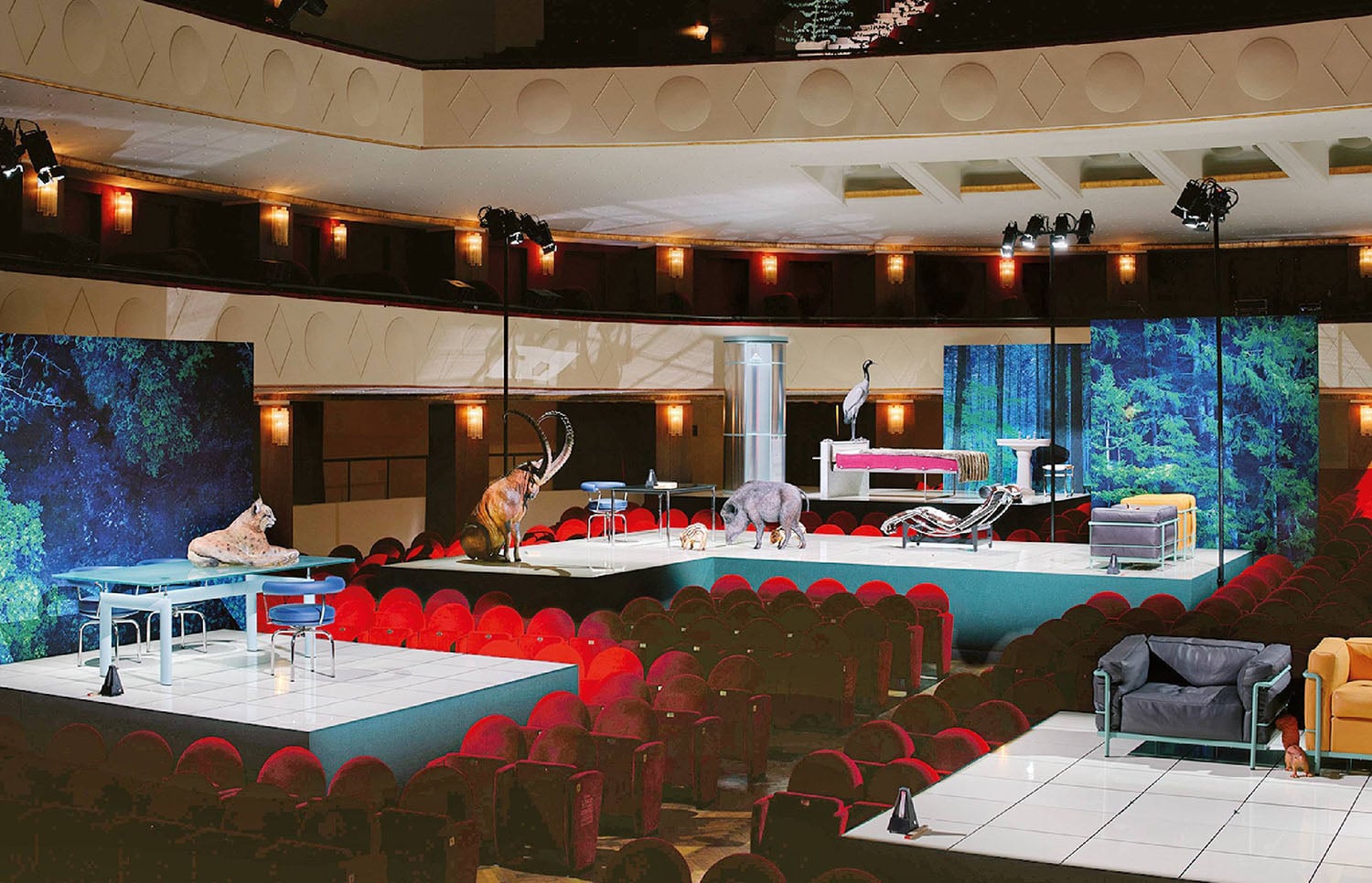 A large room with a large screen and chairs.