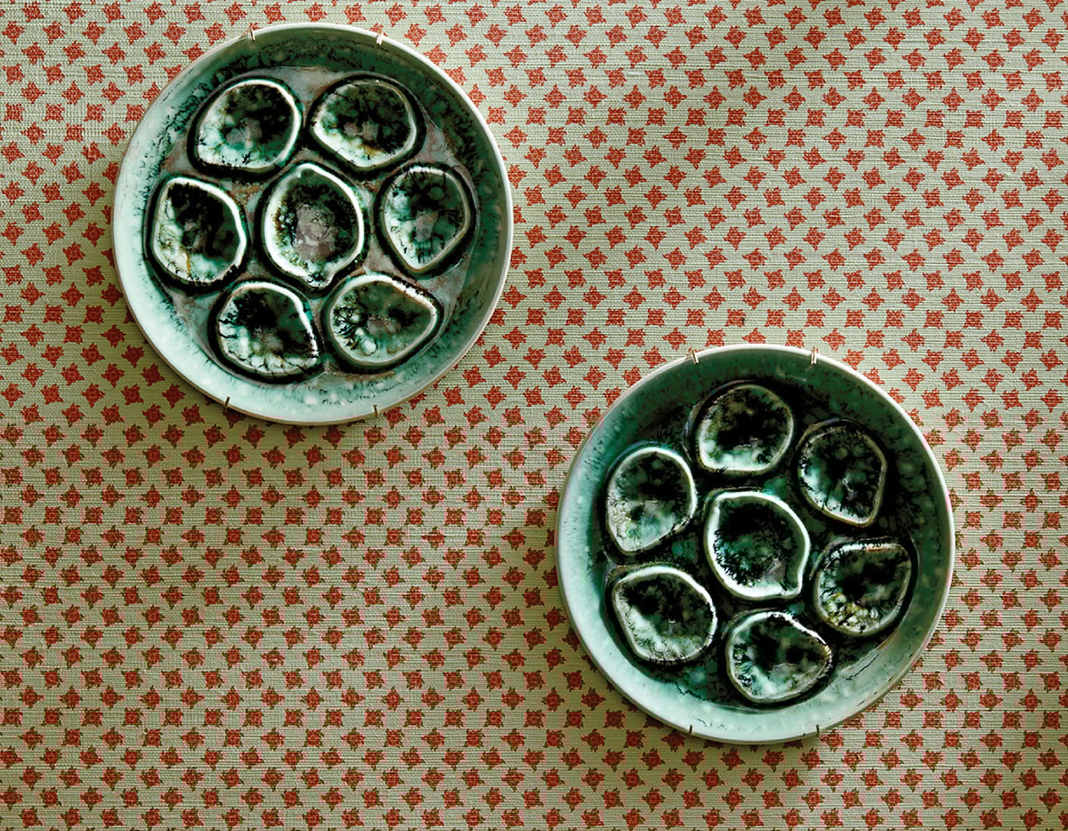 Two small blue and white bowls with octopus heads.