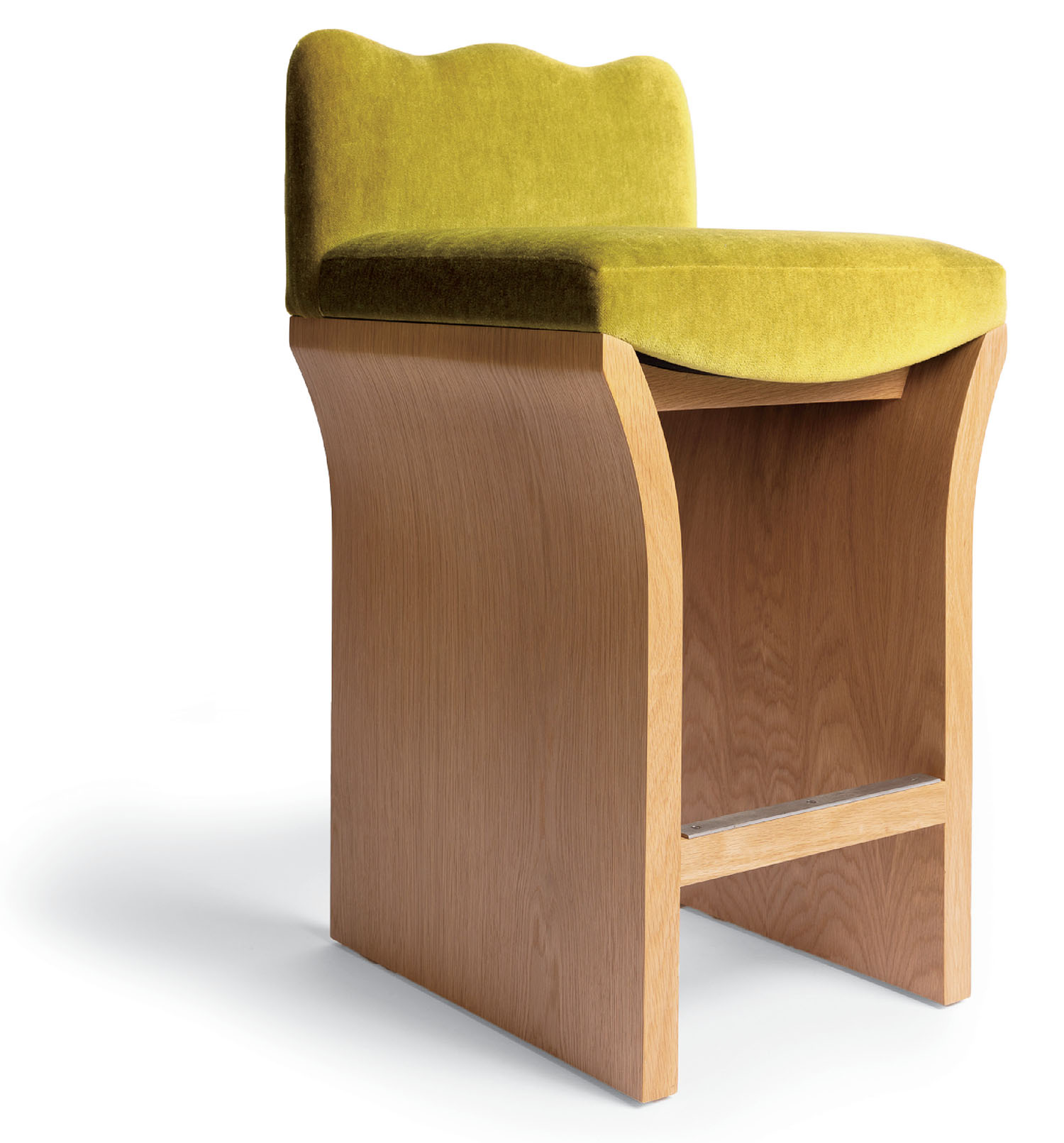 A wooden chair with a green seat.