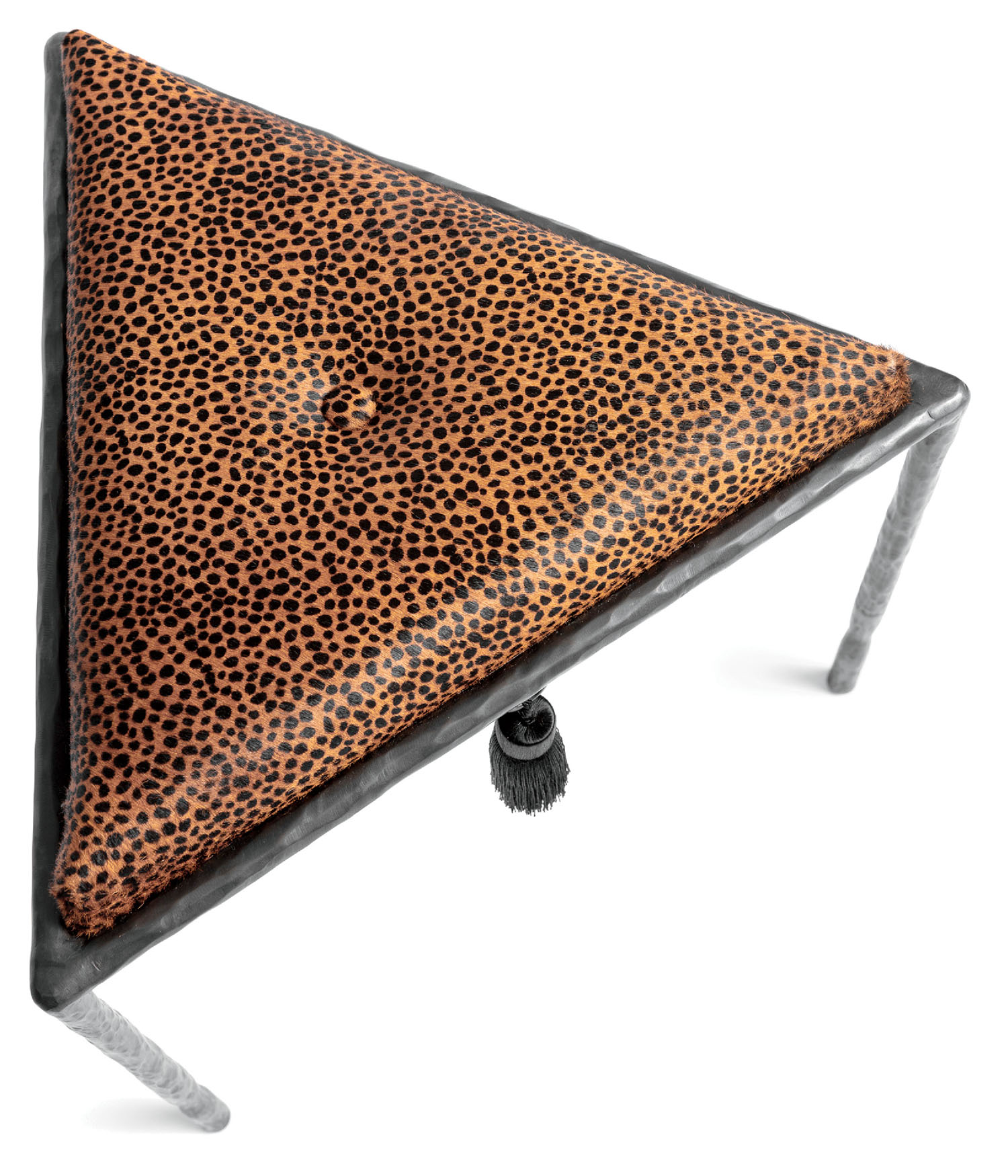 A leopard print pillow on a metal stand.