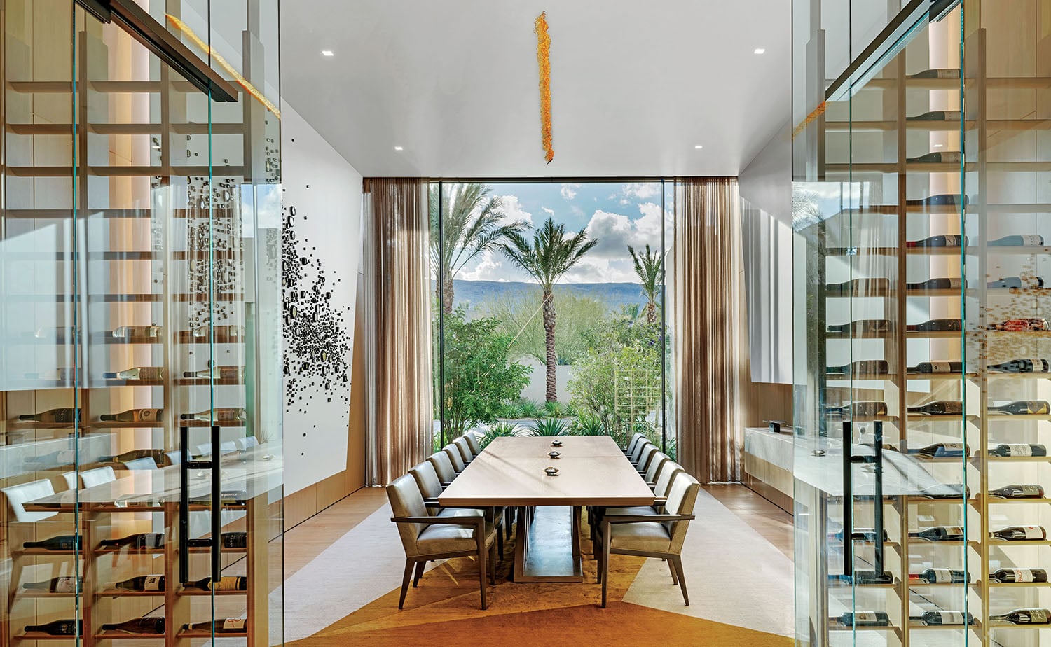A dining room with a table and chairs.