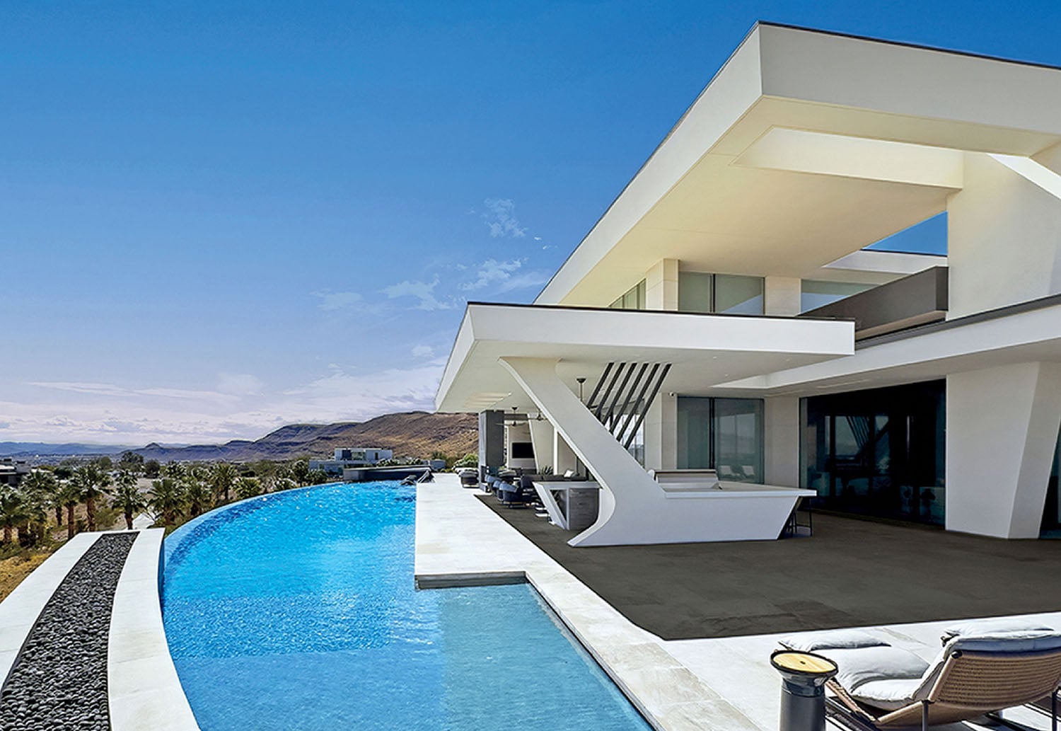 A pool with a lounge chair and a table.