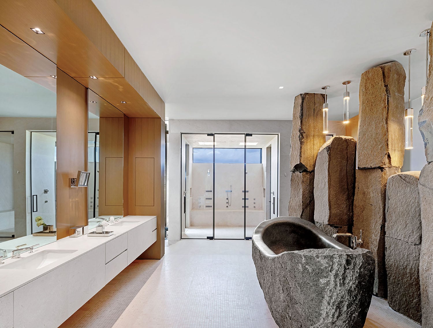 A bathroom with a large stone bathtub.