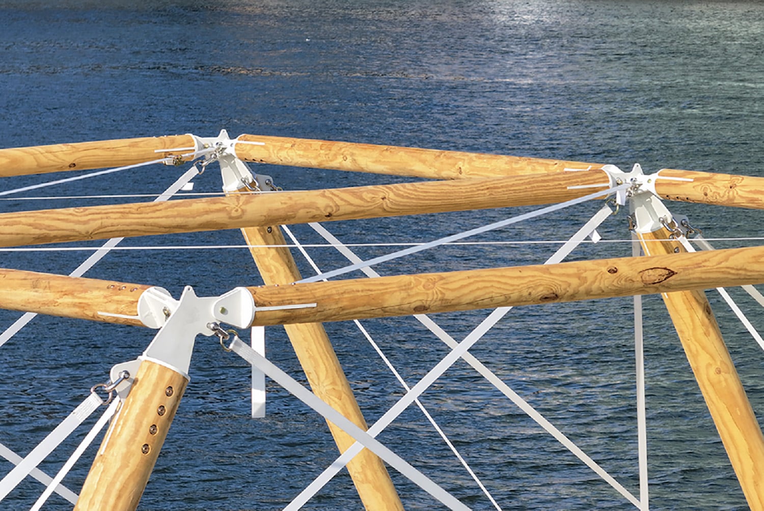 A wooden structure with white ropes.