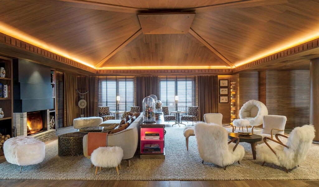 A living room with a large wooden ceiling.