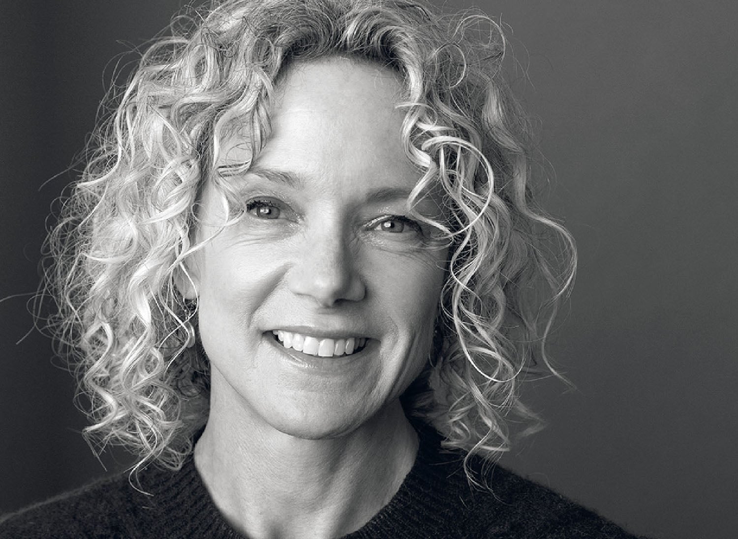 A woman with curly hair.