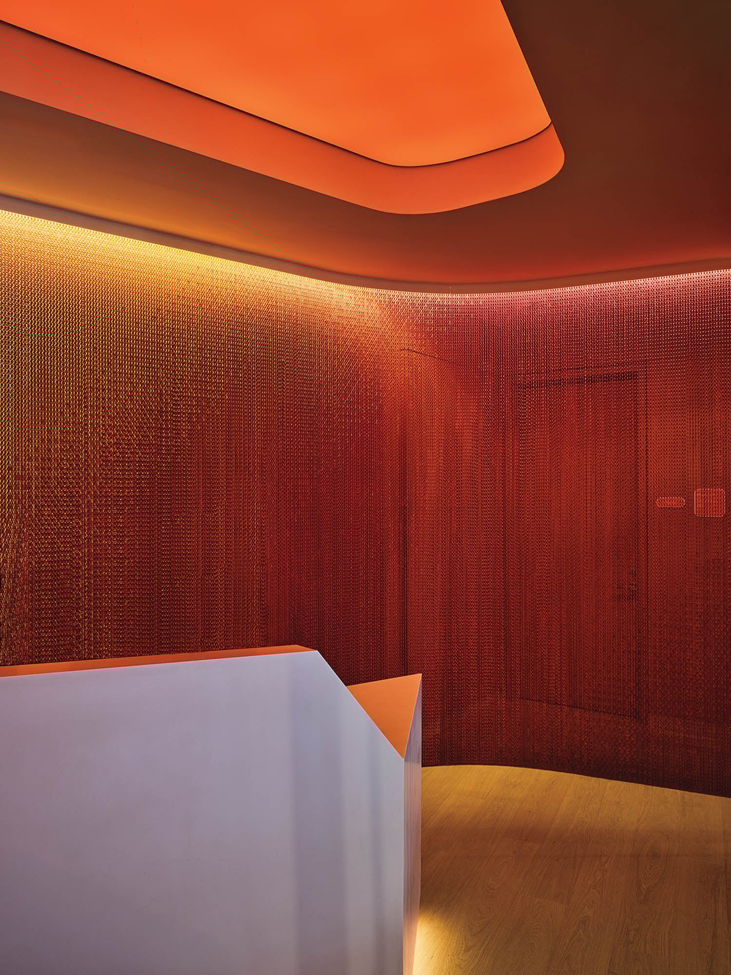 a red hued room in airport lounge