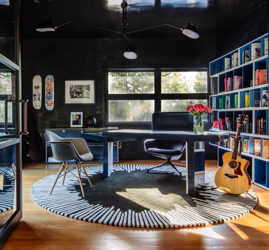 a library room with dark blue walls