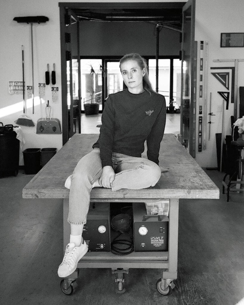 a woman sitting on a table