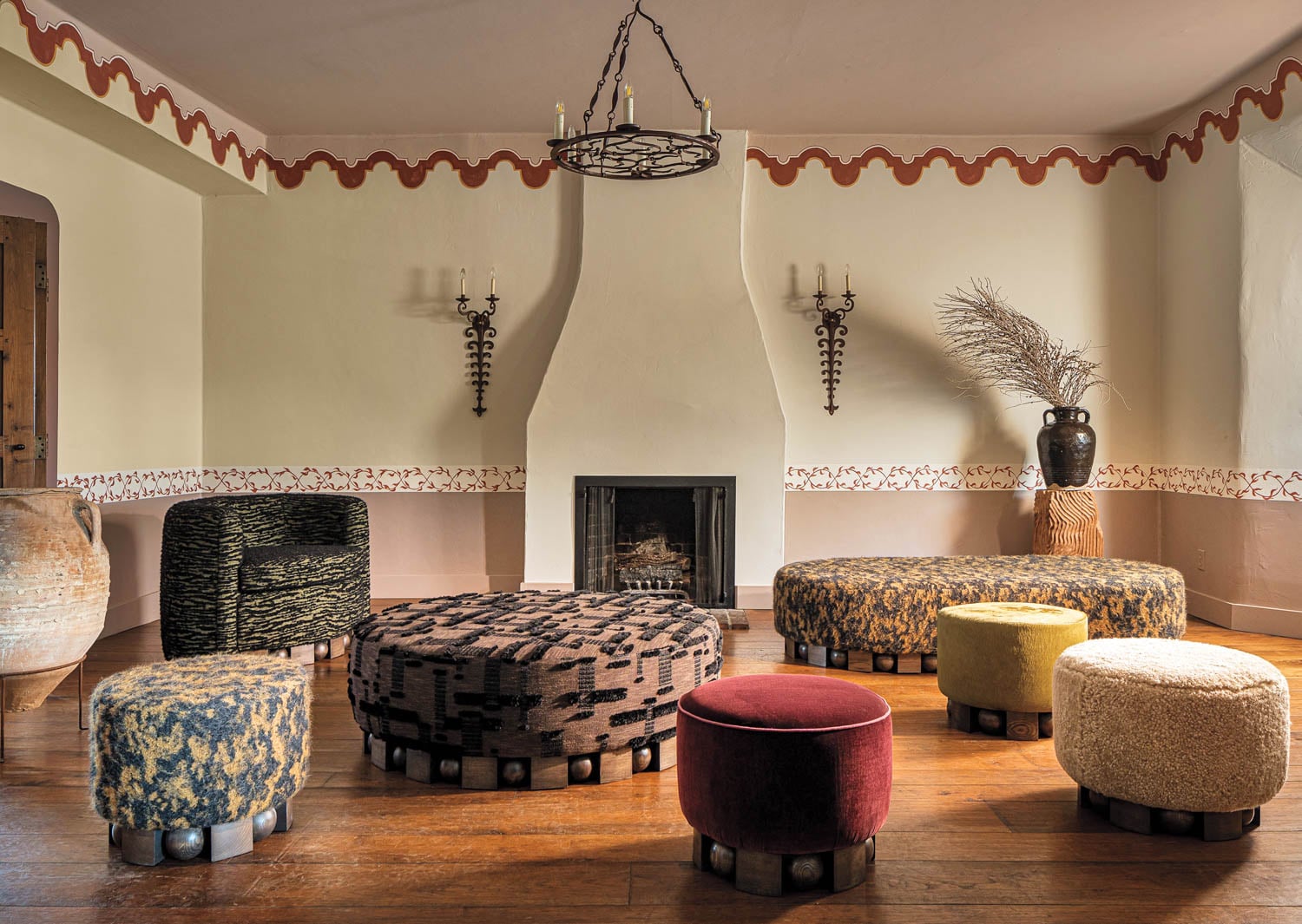 a living room with colorful ottomans