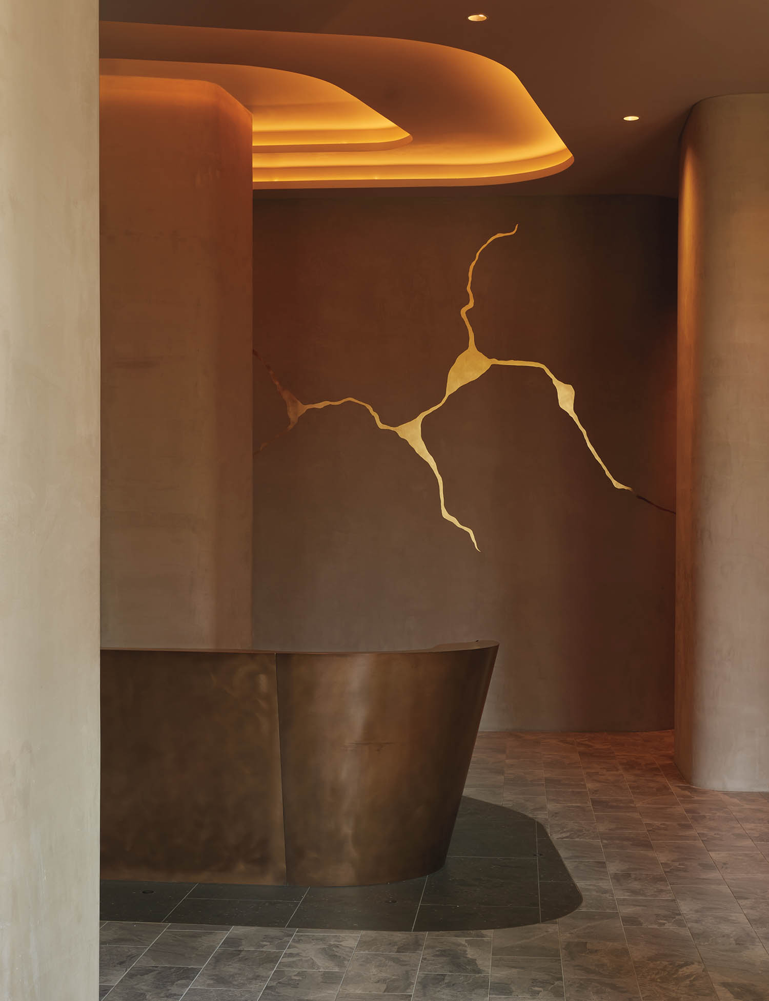 a bronze reception desk