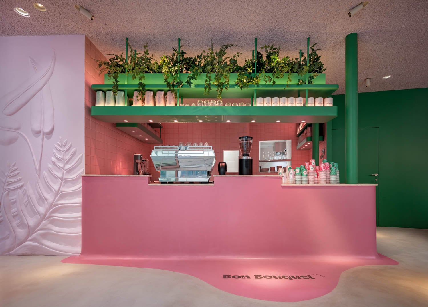 all pink coffee bar with green shelves
