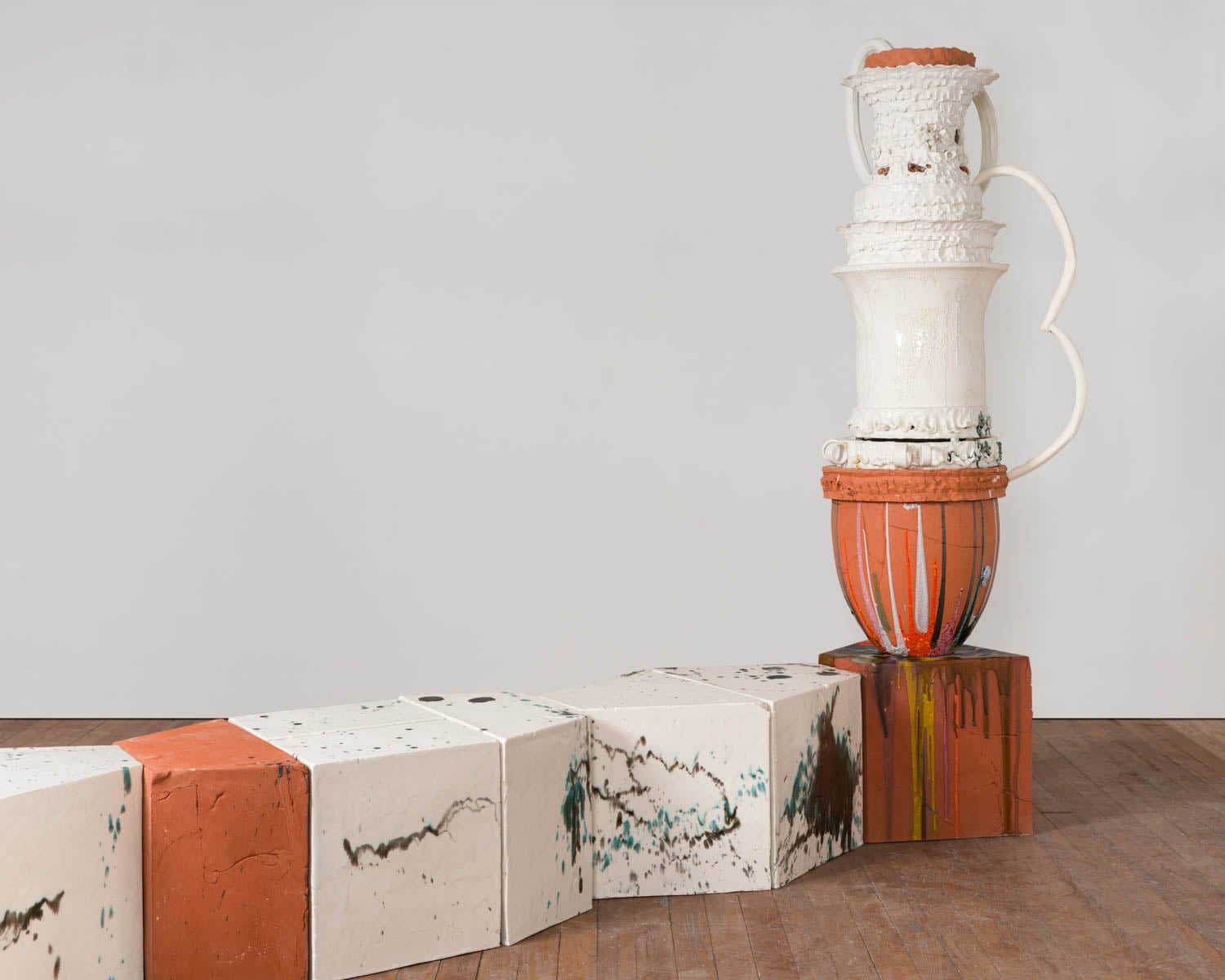 white jar with an orange bottom