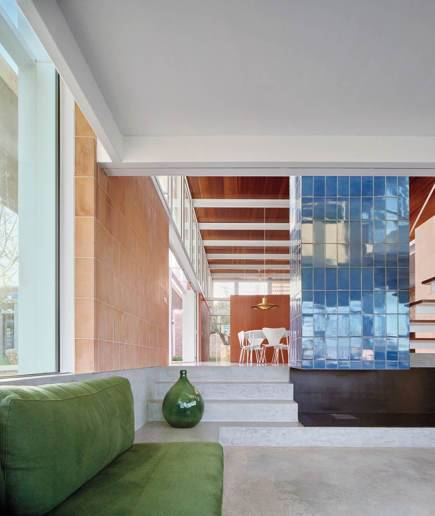 living room area with green couch and green jar