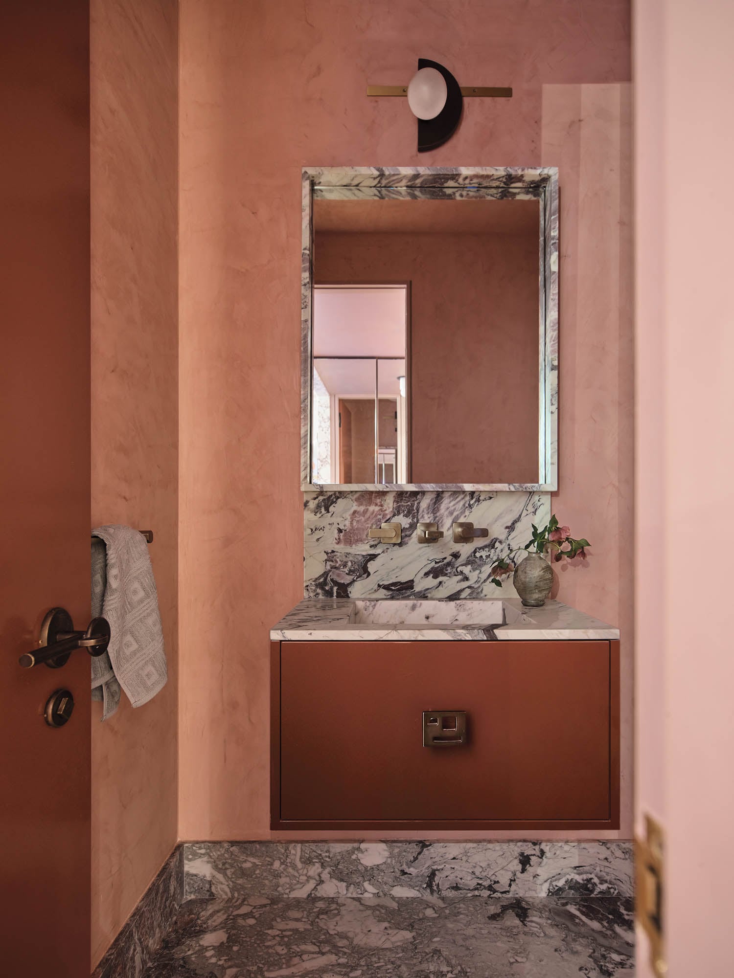 powder room with dark pink walls