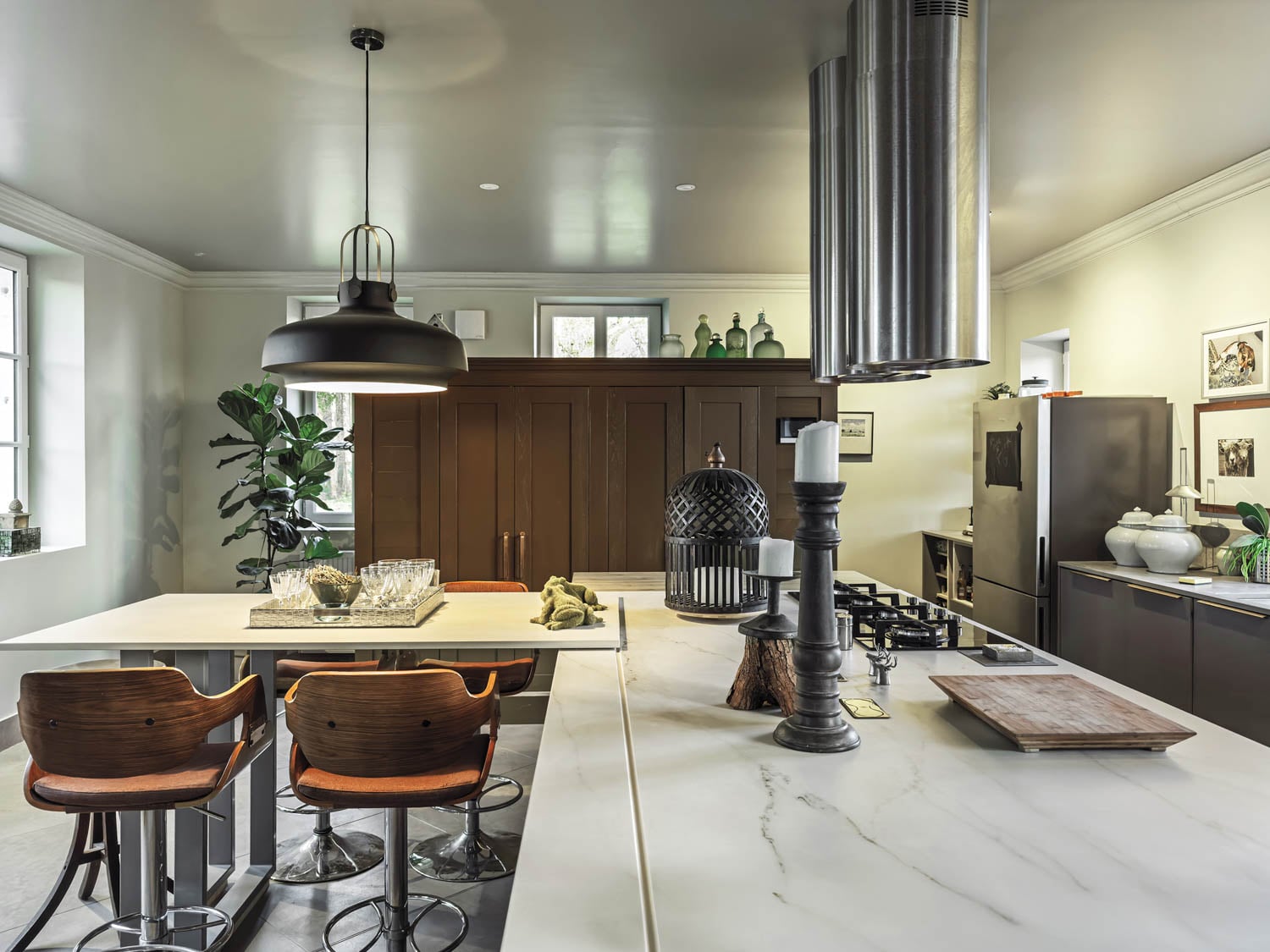 kitchen island made of marble with brown chairs