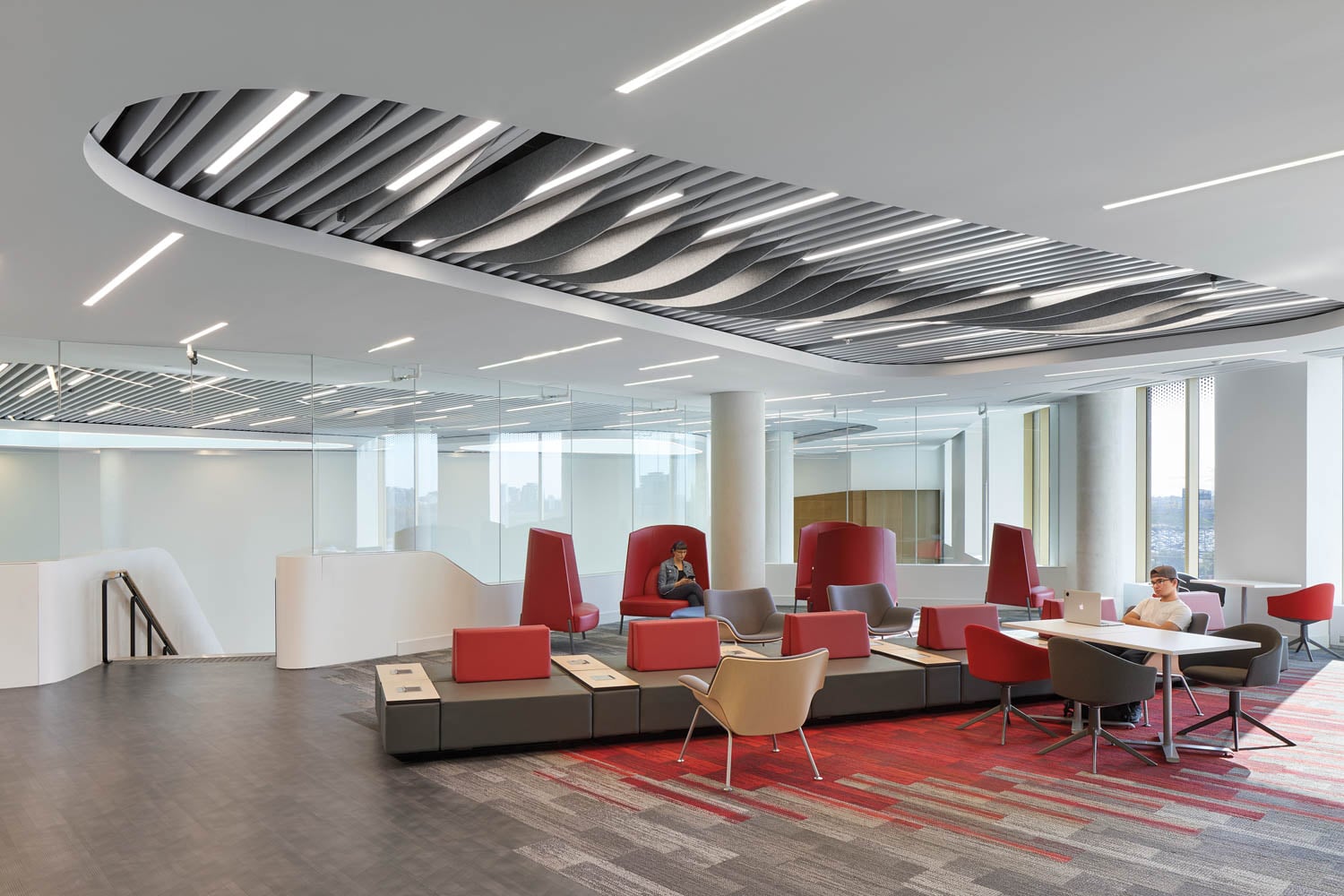 sitting lounge area with red chairs