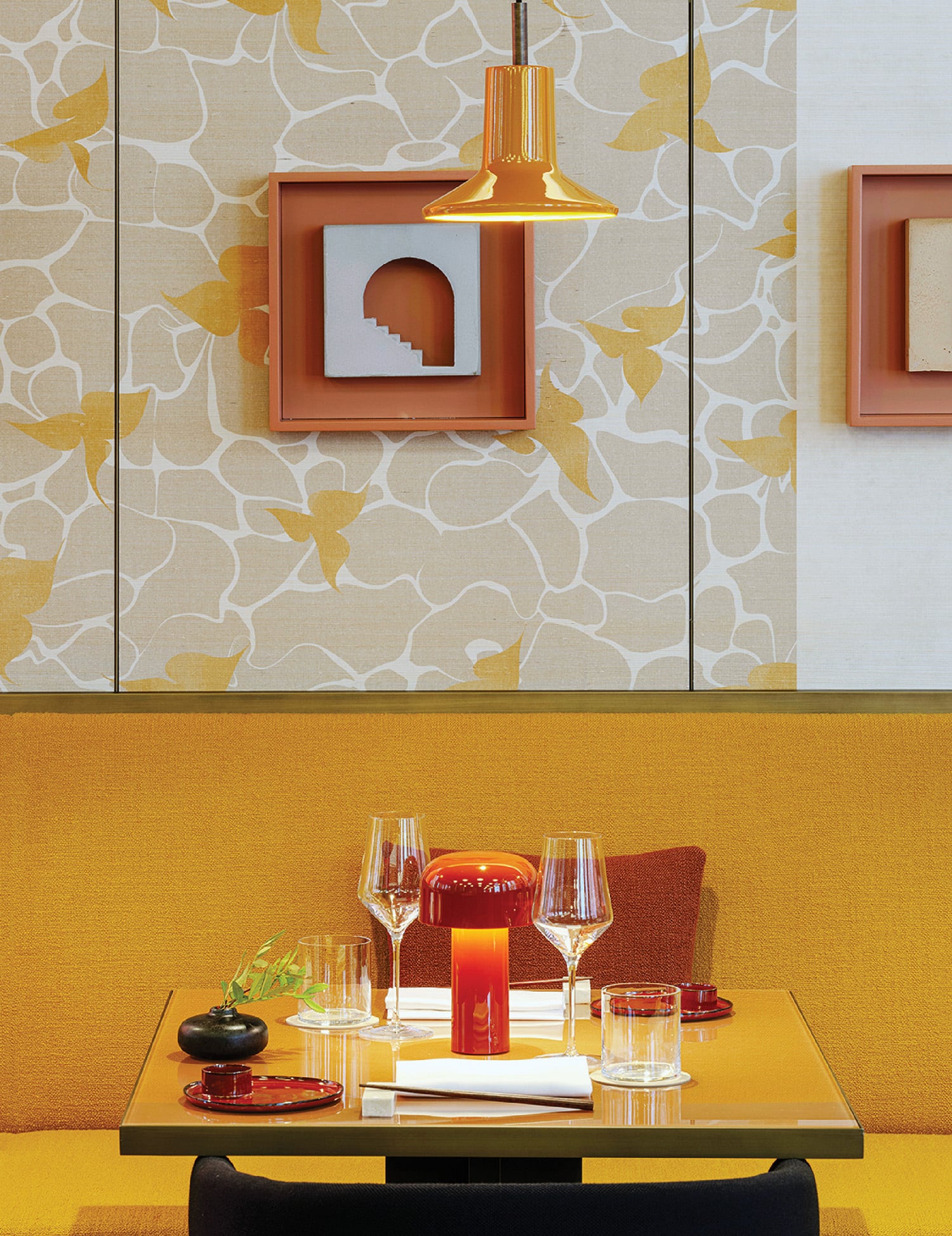 A table with a glass and a plate on it